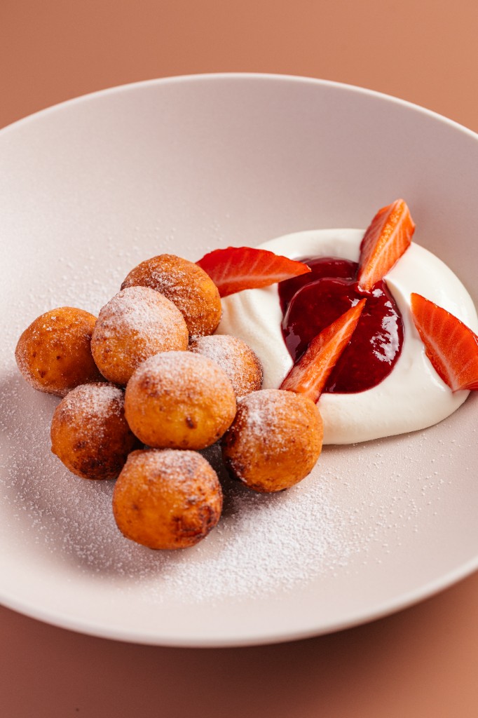 Breakfast fritters with cream and berry jam at WorkSpace
